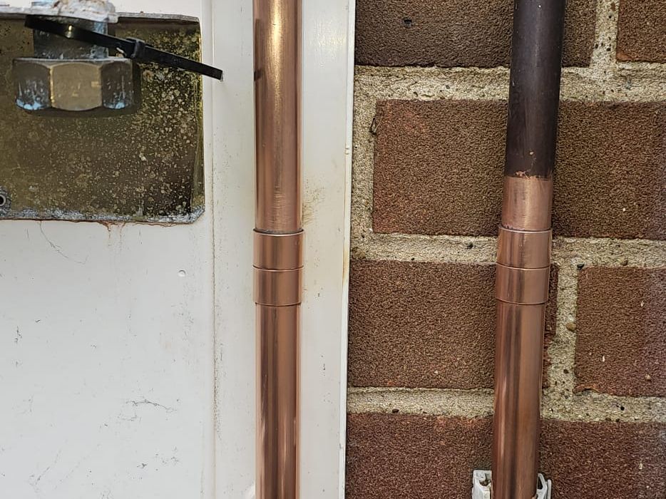 Wall-mounted gas boiler installed by Berkshire Heat with tidy copper pipework